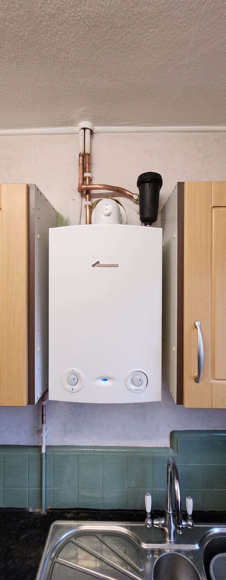 Worcester Greenstar combi boiler in kitchen with scale reducer, Surrey